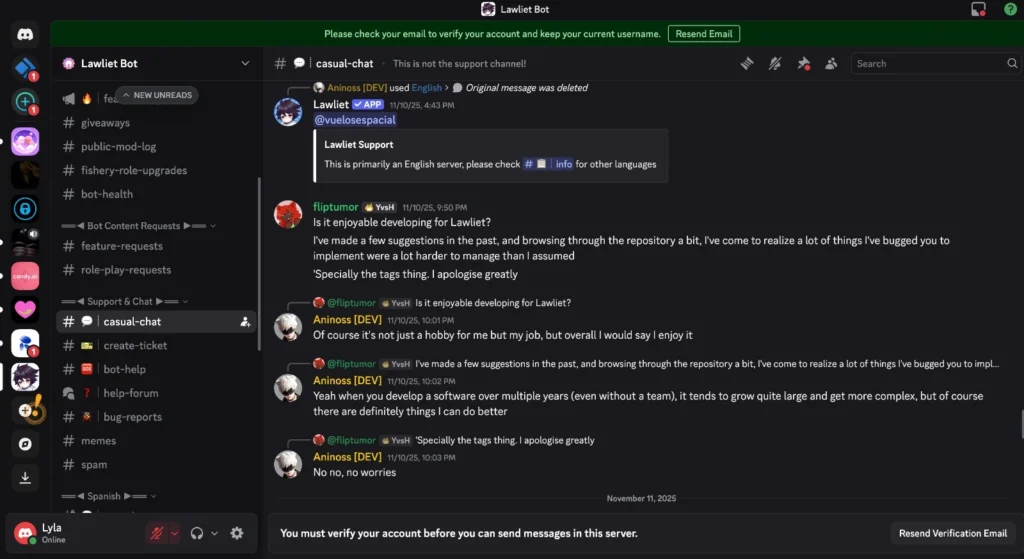 Screenshot of Discord in Lawliet Bot server, #casual-chat. Developer @flip.tumor (YvSH) says: "I’ve made a few suggestions in the past… I apologise greatly. Specially the tags thing." Aniross [DEV] responds: "Of course it’s not just a hobby for me but my job… it tends to grow quite large and get more complex." Sidebar includes bot-health, feature-requests, casual-chat. Top: "Please check your email to verify..."